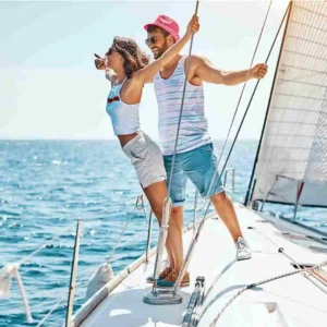 two people on a sailboat in the water