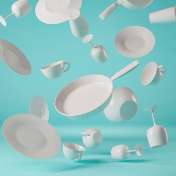3d rendered image of white dishes falling on teal background