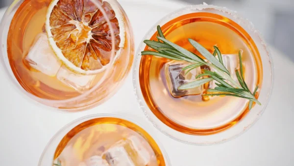 top view of three cocktails with garnishes
