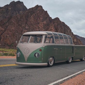 Green volkswagen on road in desert