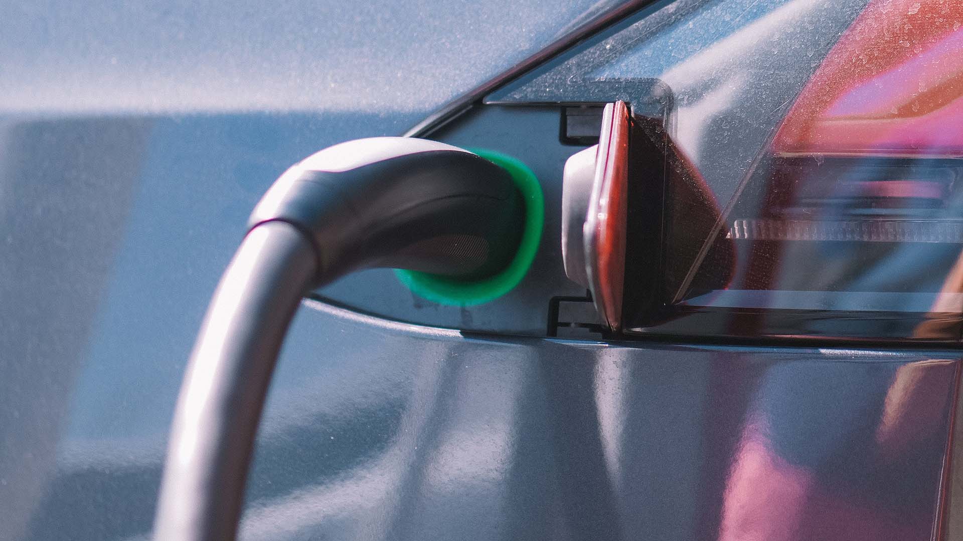 Electric car charger charging car