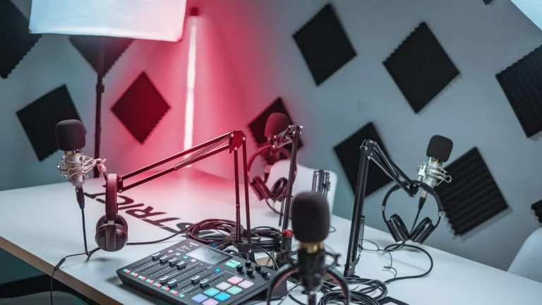 podcast studio with microphones and soundboard
