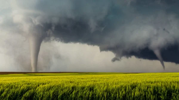 two tornados touching down on a field