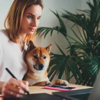 woman working at home with her dog