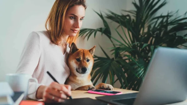 woman working at home with her dog