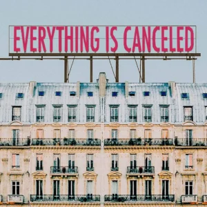 sign atop building saying that everything is canceled