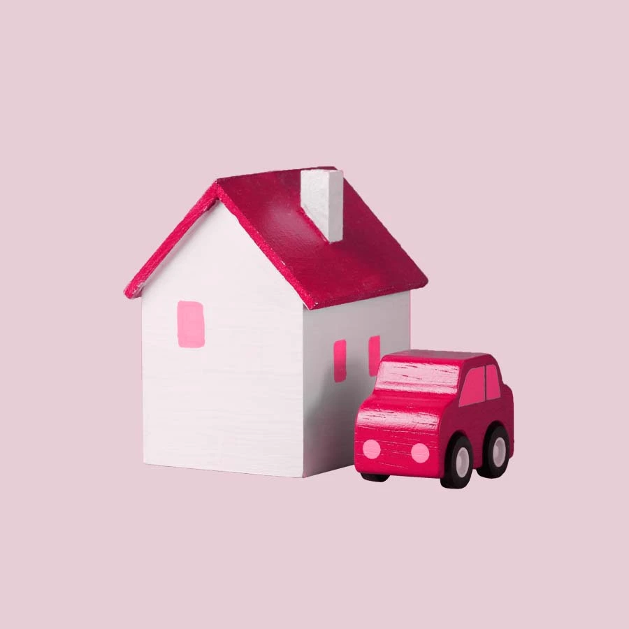 Wooden models of house and car.