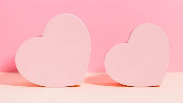 two hearts on a pink background