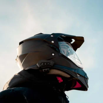 upward view of person wearing motorcycle helmet