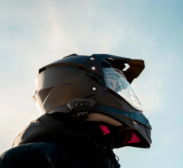 upward view of person wearing motorcycle helmet