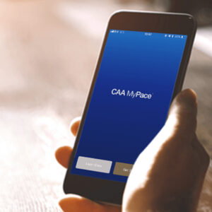CAA logo on phone screen in hand