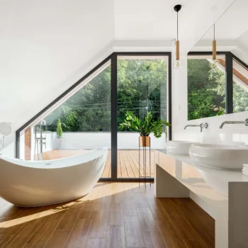large bathroom with freestanding bath tub and bright windows