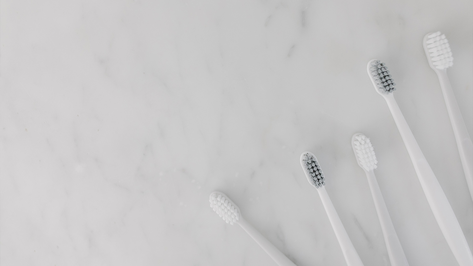 Toothbrushes on marble counter