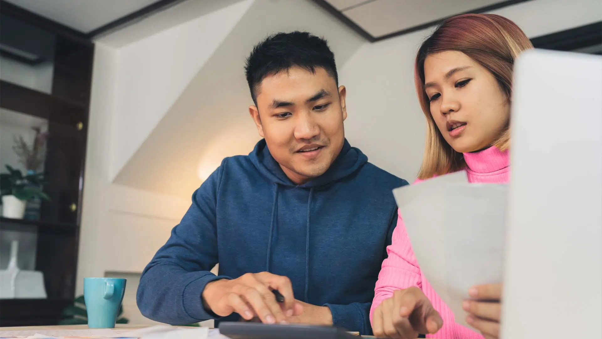 Young couple reviewing their finances.