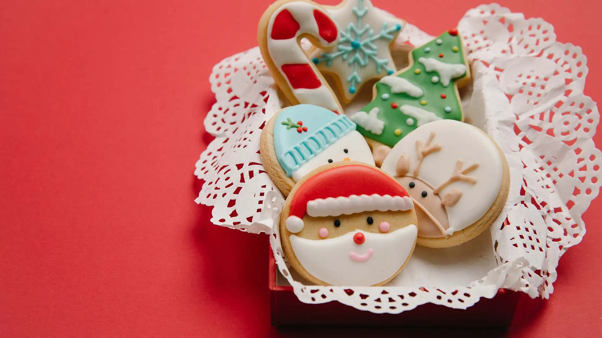 Basket of decorated holiday sugar cookies.