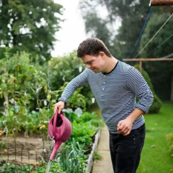 Person tending to a vegetable garden.
