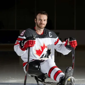 Canada’s national Para ice hockey team captain, Tyler McGregor, posing on the ice.