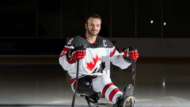 Canada’s national Para ice hockey team captain, Tyler McGregor, posing on the ice.