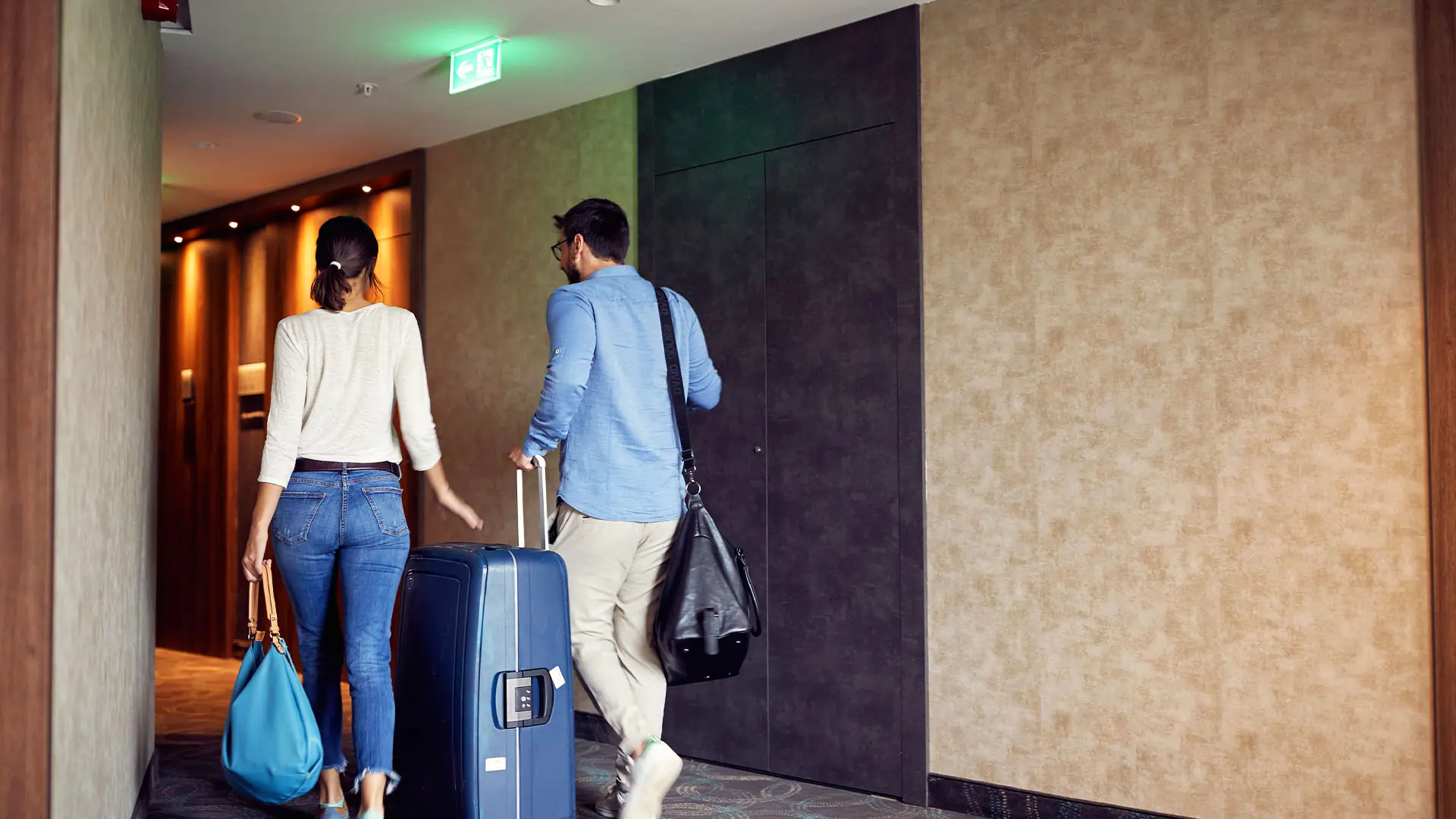 Couple checking into a hotel.