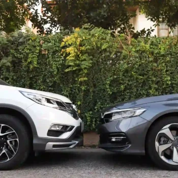 Family vehicles parked on street.