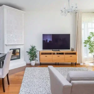 House living room with TV and piano.