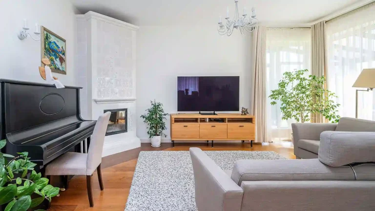 House living room with TV and piano.